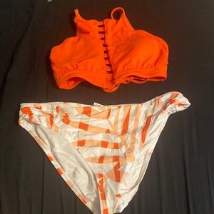Kids matching swimsuit set! It is a size 10 and is orange and white with pattern
